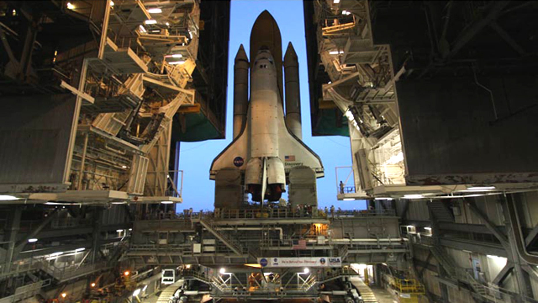 Space shuttle Discovery moves out of the cavernous Vehicle Assembly Building for the last time on Sept. 20, 2010 to prepare for its final mission to the International Space Station.