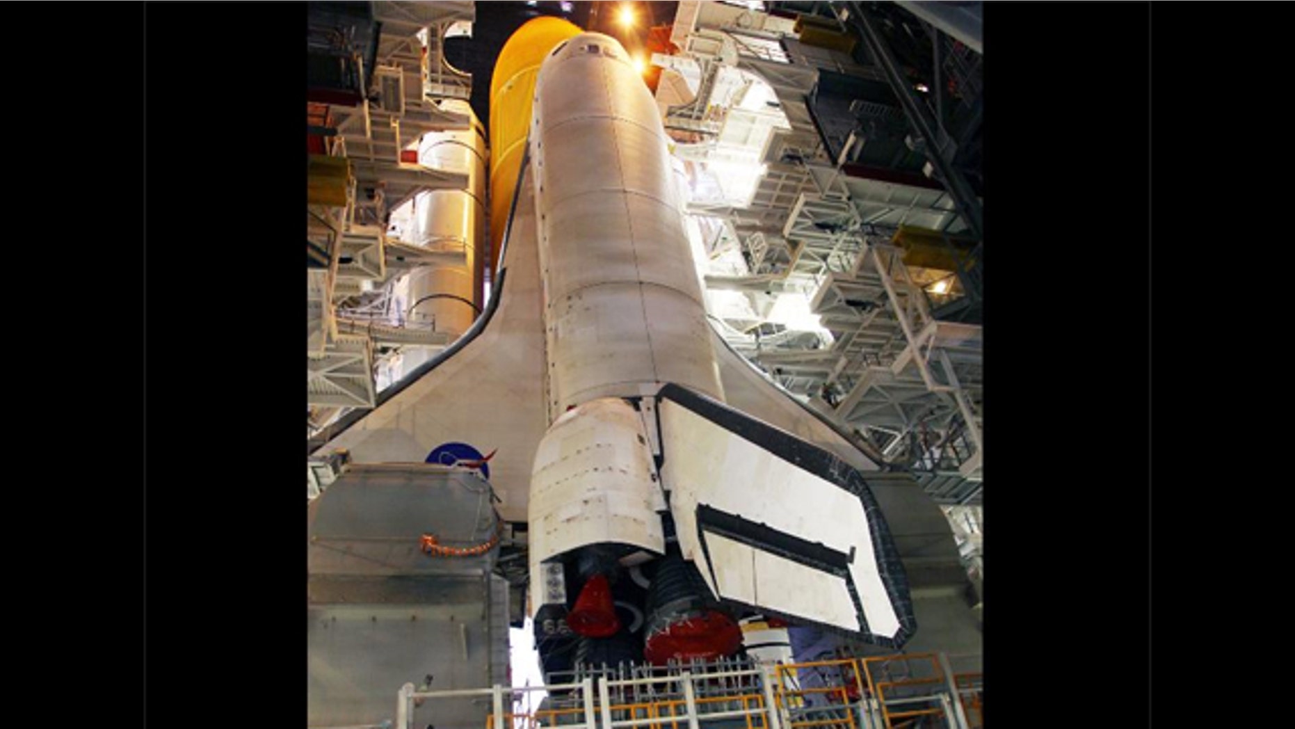 Work platforms inside the Vehicle Assembly Building at NASA's Kennedy Space Center in Florida surround the space shuttle Discovery, its solid rocket boosters and external fuel tank.