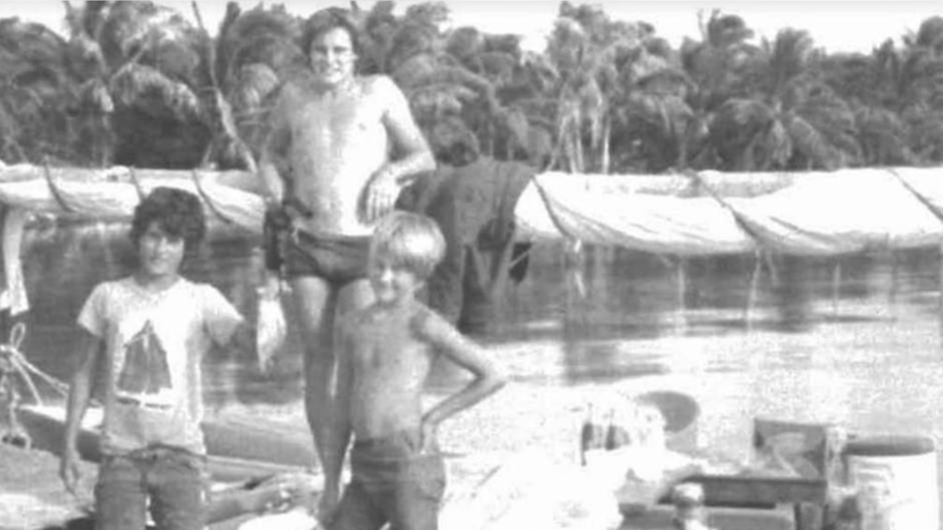 British tourist Christopher Farmer with the sons of Silas Duane Boston in a 1978 photo. (Sacramento U.S. Attorney's Office)