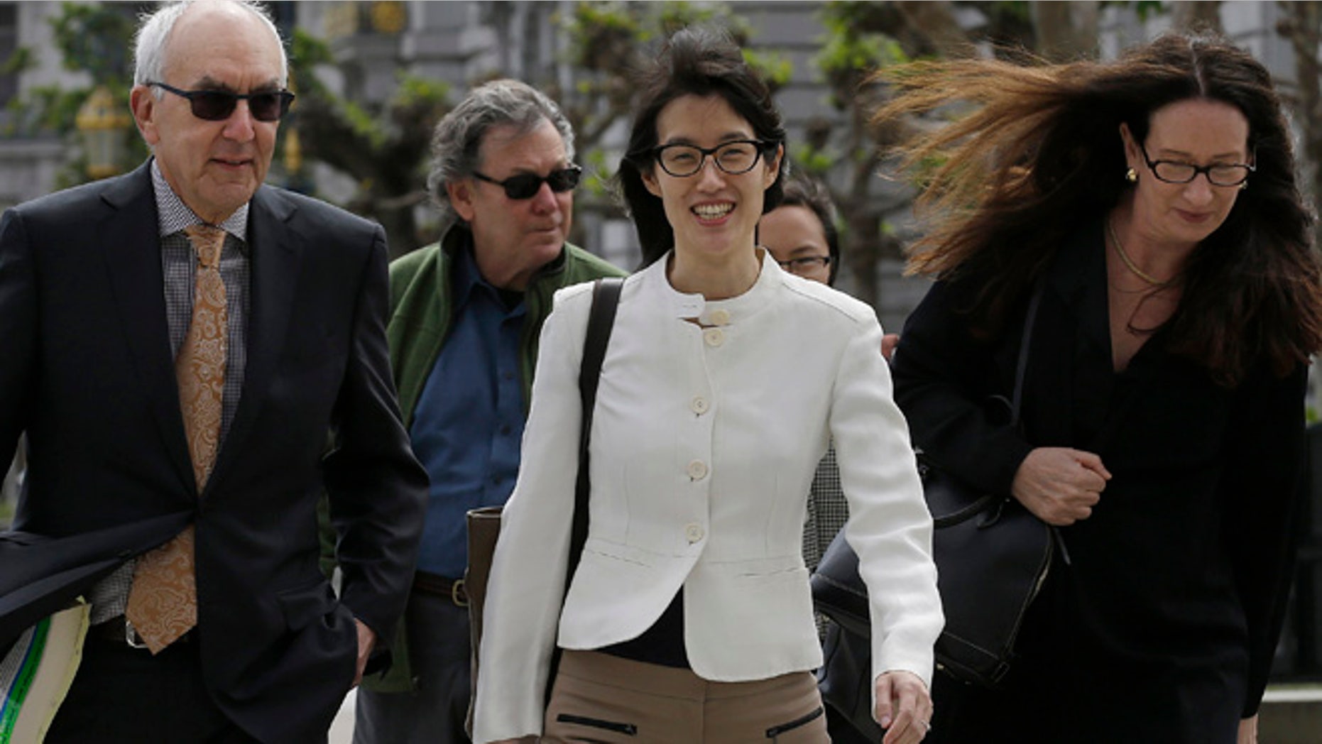 Mar. 17, 2015: Ellen Pao, center, walks to Civic Center Courthouse in San Francisco (AP)
