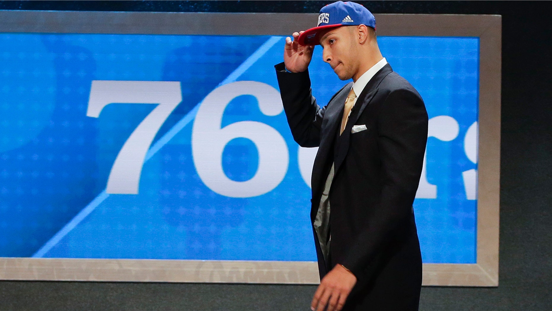 June 23, 2016: LSU's Ben Simmons walks up on stage after being selected as the top pick by the Philadelphia 76ers during the NBA Draft in New York.
