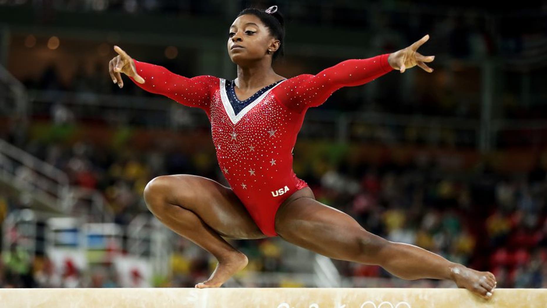 RIO DE JANEIRO, BRAZIL - AUGUST 15: Simone Biles of the United States competes in the Balance Beam Final on day 10 of the Rio 2016 Olympic Games at Rio Olympic Arena on August 15, 2016 in Rio de Janeiro, Brazil. (Photo by Lars Baron/Getty Images)