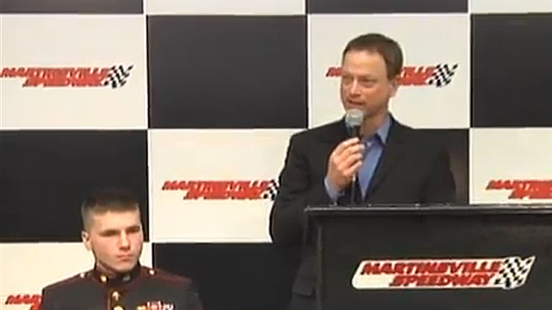 Marine Cpl. J.B. Kearns, who lost both legs and his right arm last April while on his third tour of duty in Afghanistan, appears with actor-humanitarian Gary Sinise in February to announce a benefit concert to help offset costs for the construction of Kearns' home in Ararat, Va. (YouTube/Tunnel to Towers Foundation)