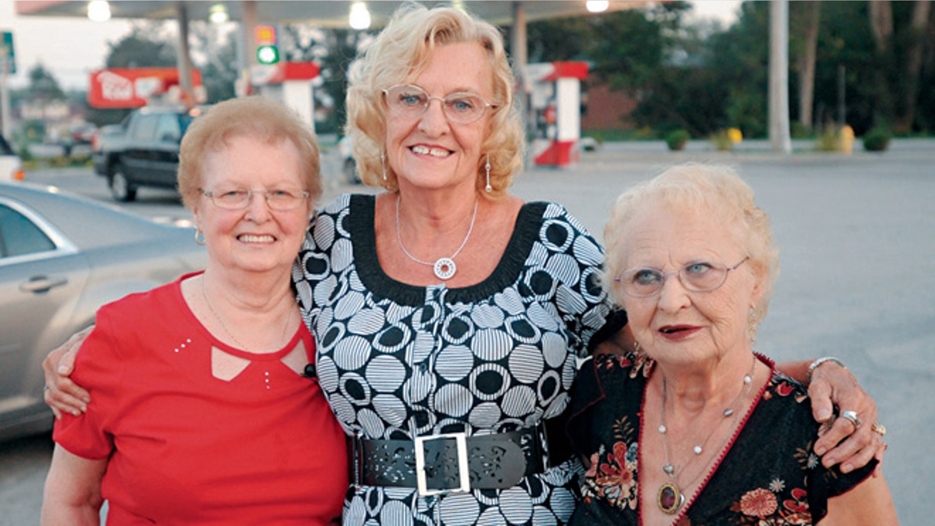 In this Sept. 10, 2013 photo, three sisters, from left, Shirley Mortellaro, 78, Mary Kidwell, 77, and Joan Billings, 80 are reunited in Batavia, N.Y., 73 years after their mother abandoned the older two in Toronto and disappeared with Mary.