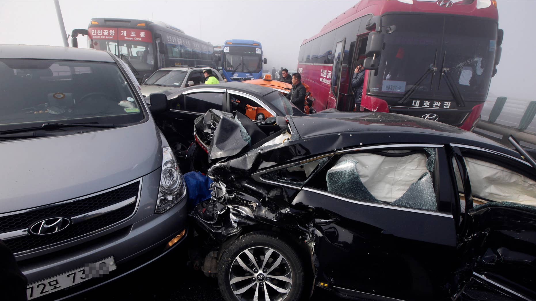 Feb. 11, 2015: Damaged vehicles sit on Yeongjong Bridge in Incheon, South Korea.