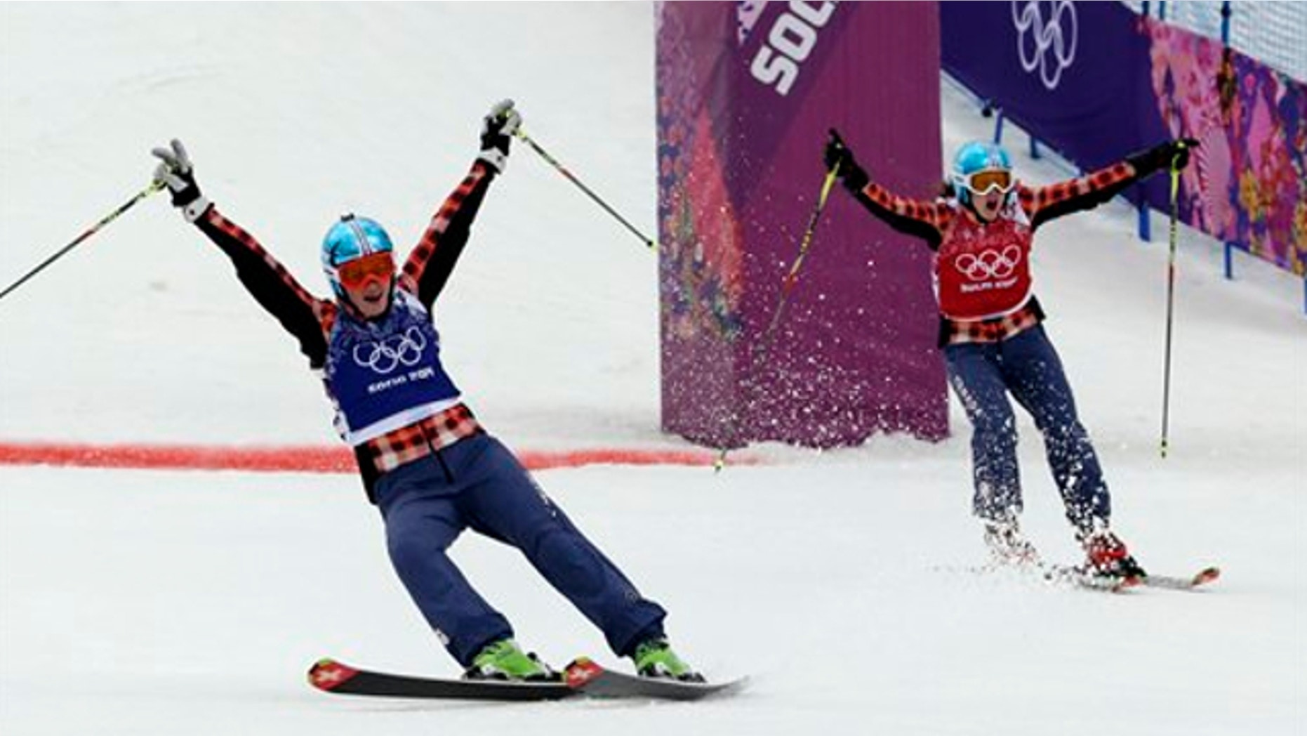 Feb. 21, 2014: Canada's Marielle Thompson, left, celebrates winning the gold medal ahead of compatriot Kelsey Serwa right, in the women's ski cross final at the Rosa Khutor Extreme Park, at the 2014 Winter Olympics.