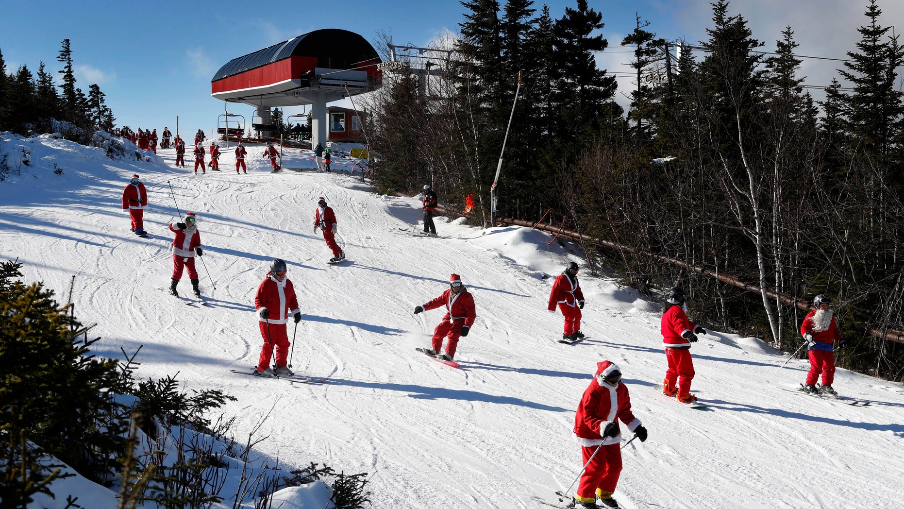 Skiers dressed as Santa Claus ski en masse in Maine.