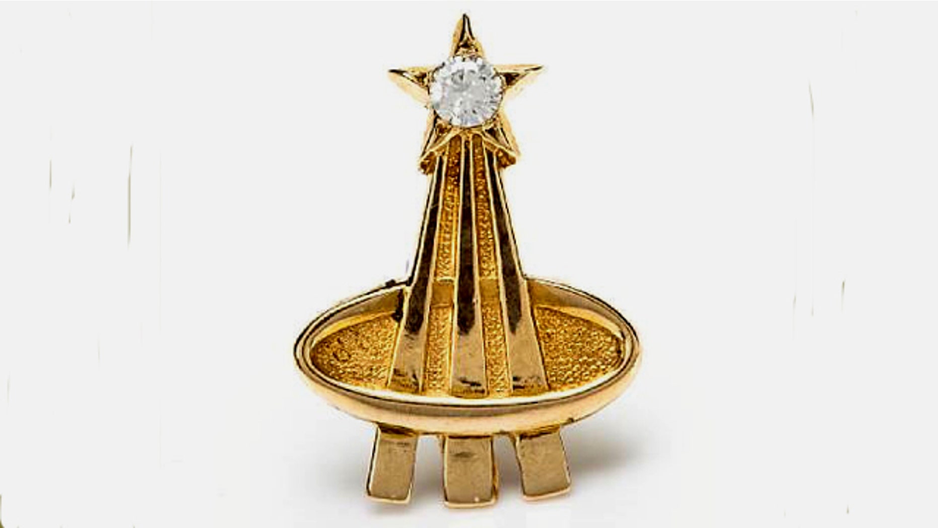 A diamond and gold pin given to Deke Slayton by the widows of the astronauts killed in the Apollo 1 fire.