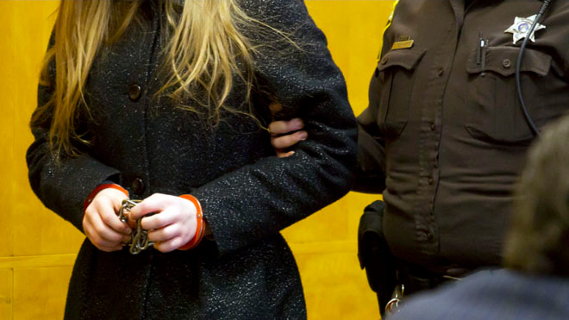 Nov. 18, 2014: One of two 12-year-old girls accused of stabbing a classmate to please the fictional character Slender Man is led into a courtroom at the Waukesha County Courthouse in Waukesha, Wis.