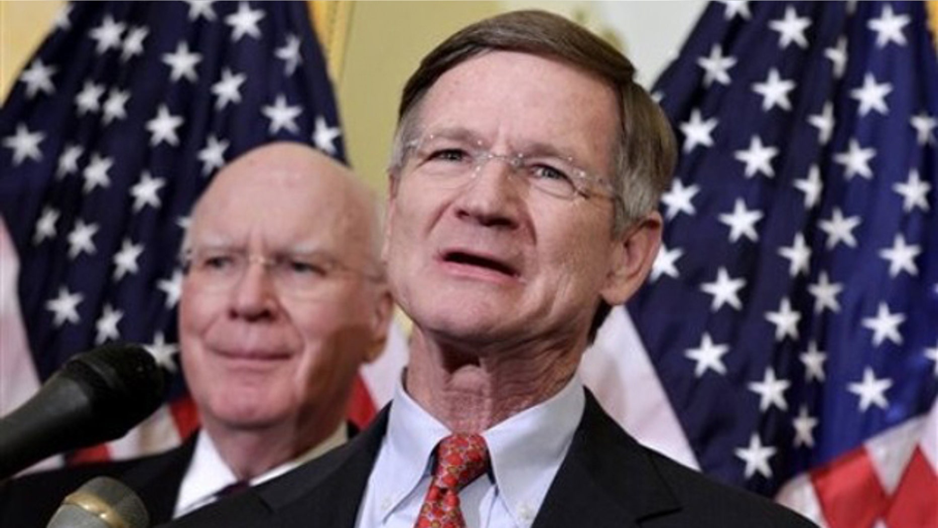 April 4, 2011: Rep. Lamar Smith, right, accompanied by Sen. Patrick Leahy, speaks during a news conference on Capitol Hill about online piracy.