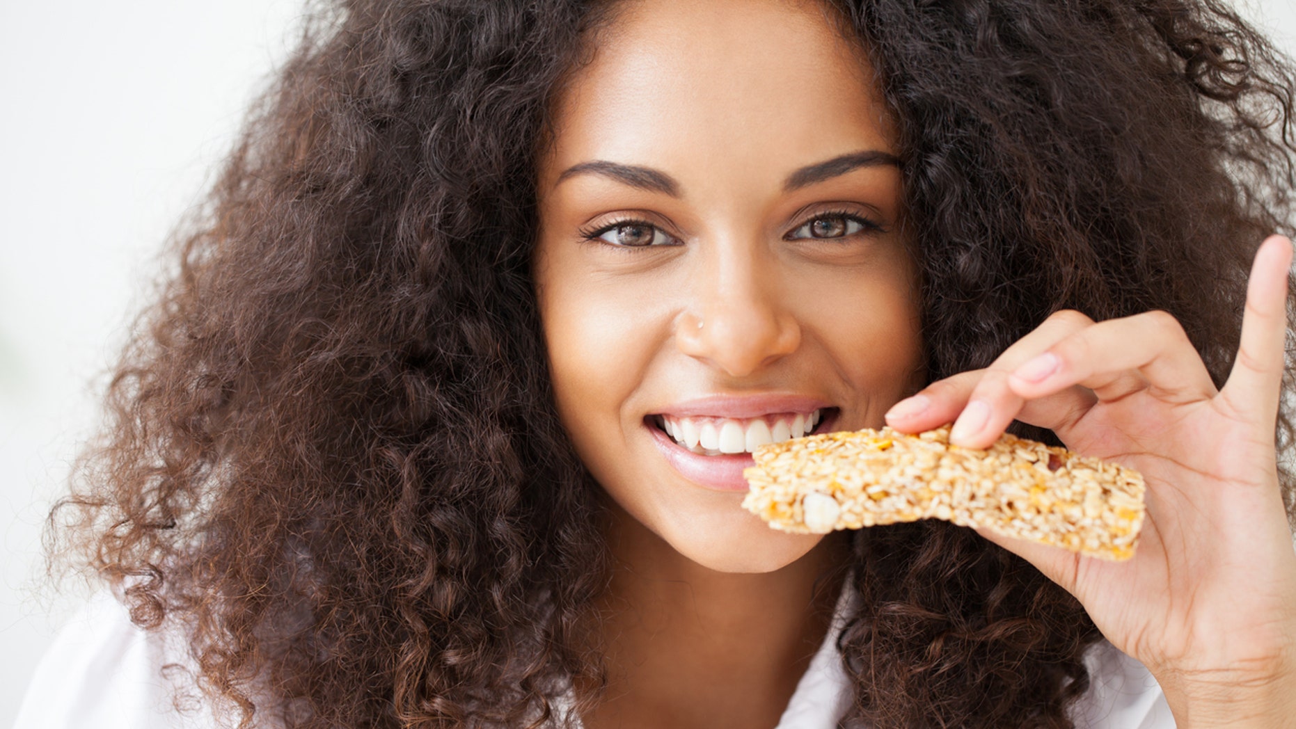 Young woman about to eat a healthy snack.