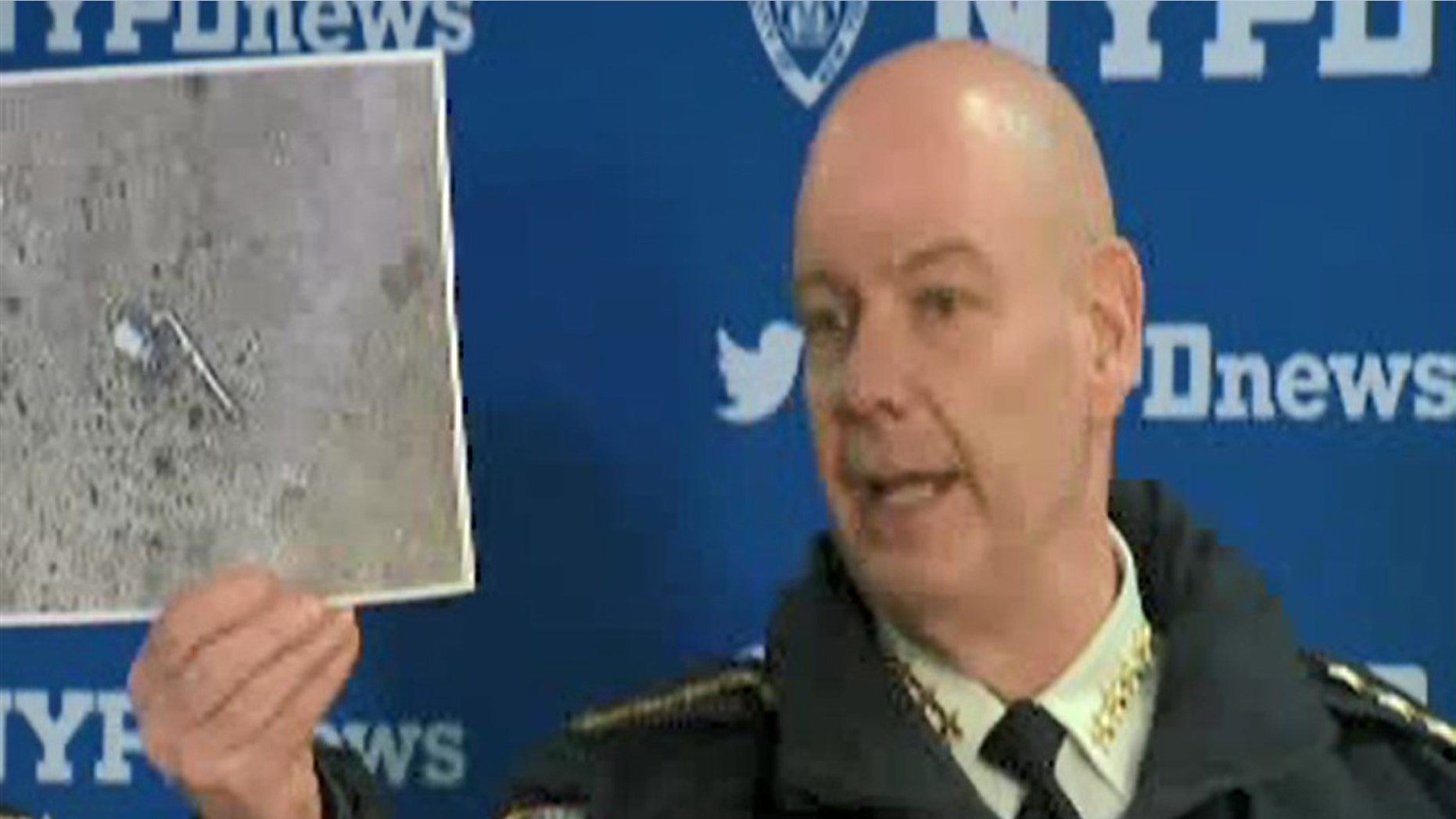 NYPD Chief of Department Terence Monahan at a press conference on Wednesday showing what 911 callers had described as a "silver firearm" that a man was pointing at people on the street.