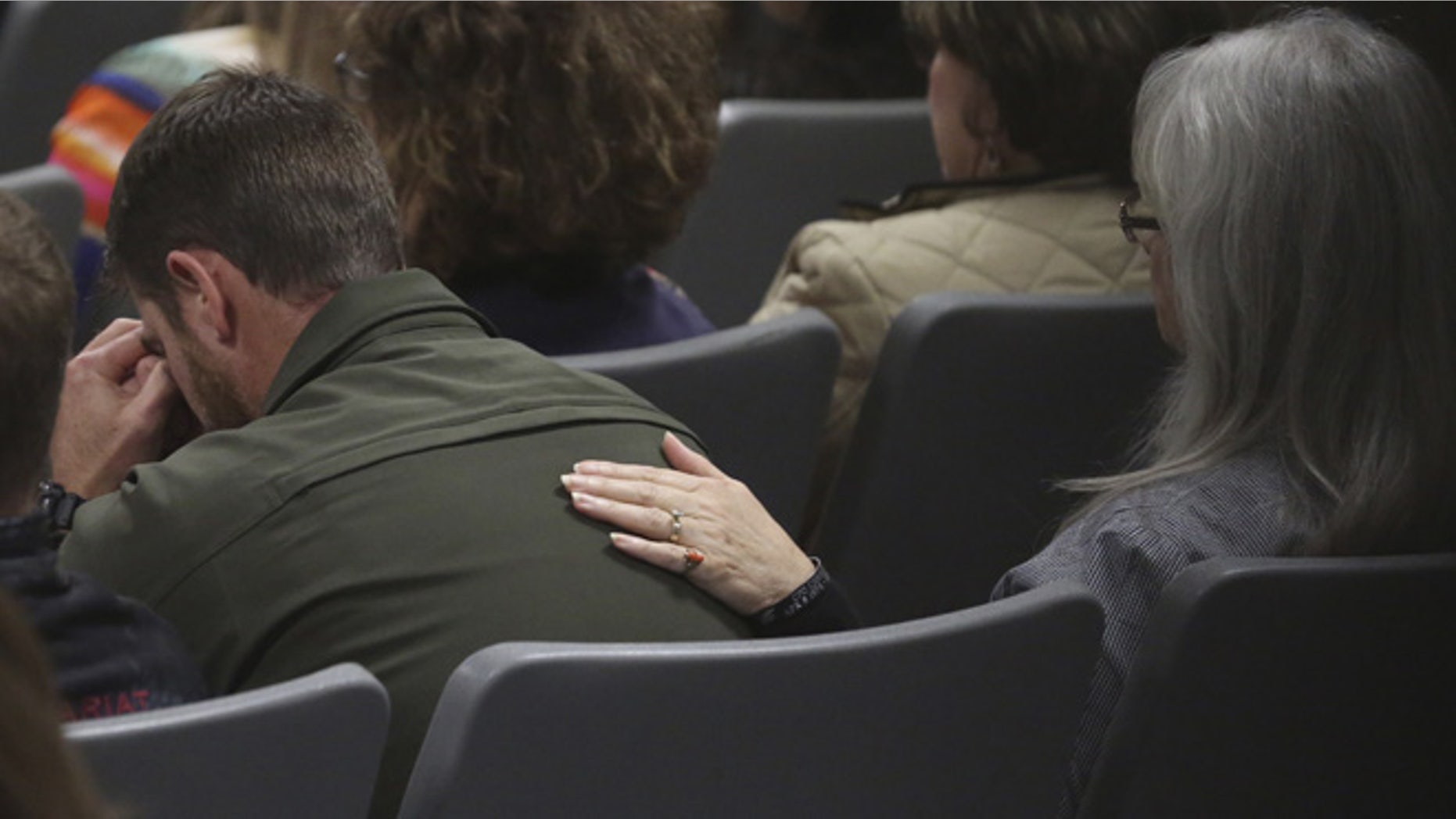 Feb. 20, 2015: Jeff Kyle, left, brother of former Navy SEAL Chris Kyle, is comforted by his mother Deby Kyle during testimony about his brother's death during the Eddie Ray Routh capital murder trial at the Erath County, Donald R. Jones Justice Center in Stephenville, Texas. (AP)