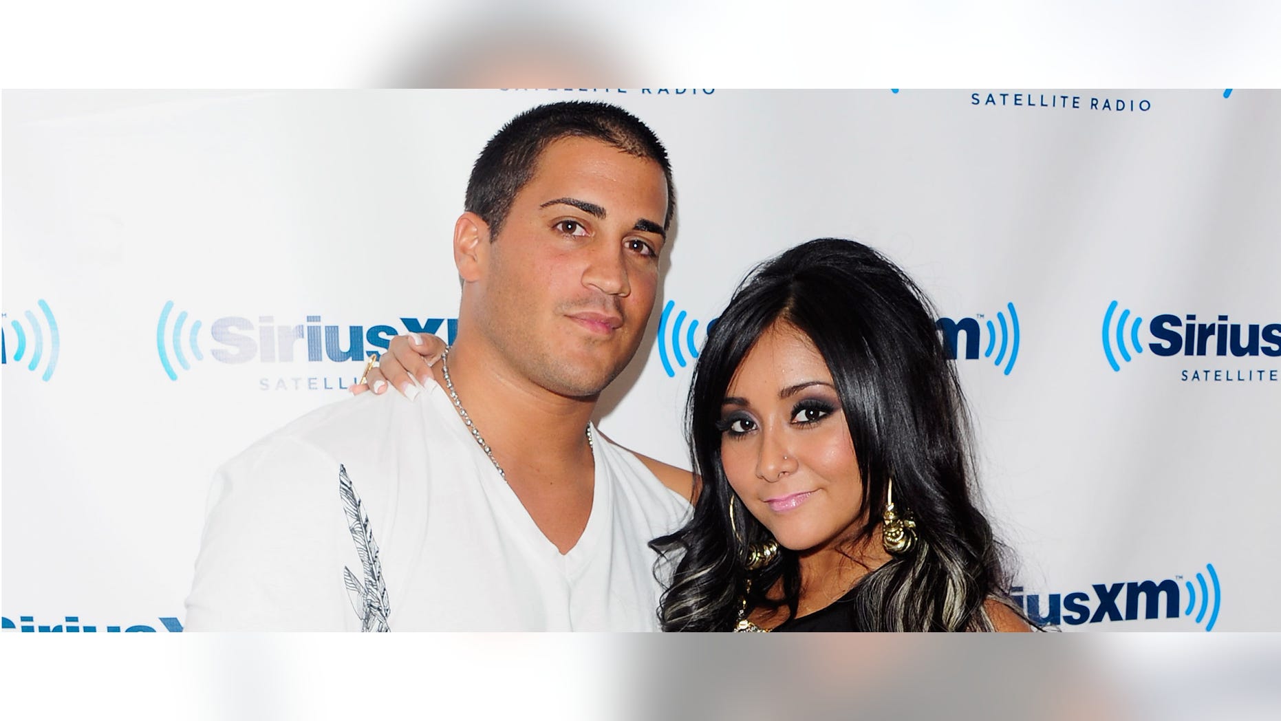 NEW YORK, NY - AUGUST 11: Jionni LaValle and TV personality Nicole "Snooki" Polizzi visit SiriusXM's studio on August 11, 2011 in New York City. (Photo by Andrew H. Walker/Getty Images)