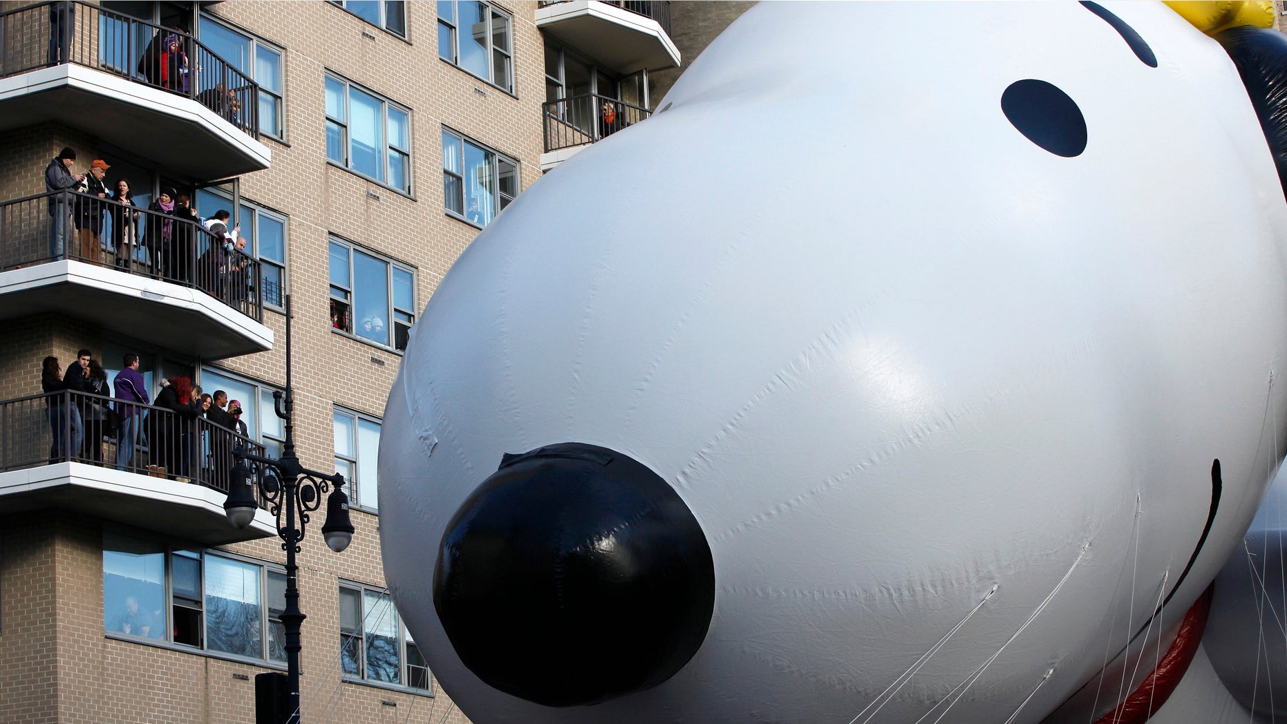 Nov. 28, 2013: The Snoopy and Woodstock balloon floats down Central Park West during the 87th Macy's Thanksgiving Day Parade in New York
