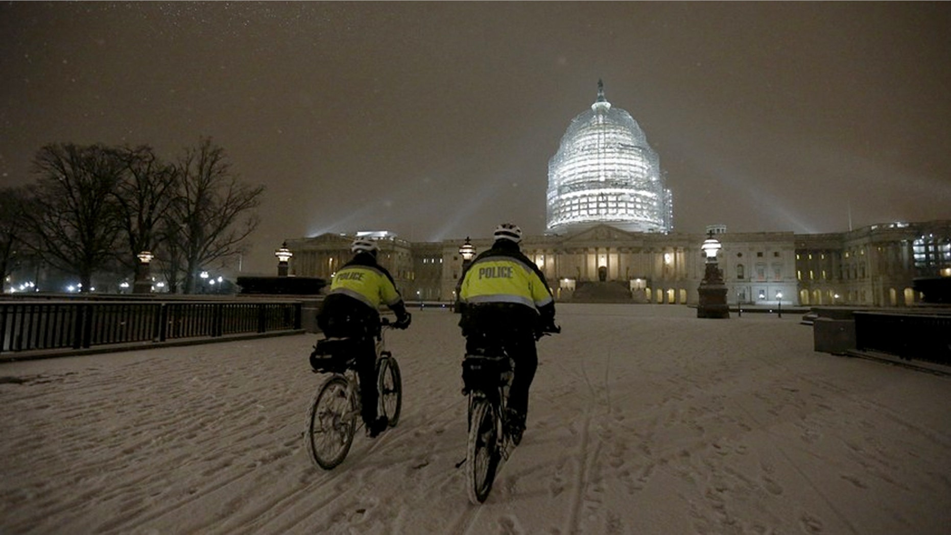 Police patrol on their bikes in Washington, D.C. on Wednesday evening as snow fell. Some predict as much as two feet of snow in Washington, D.C. --and that's on top of covering that hit the Capitol Wednesday evening.