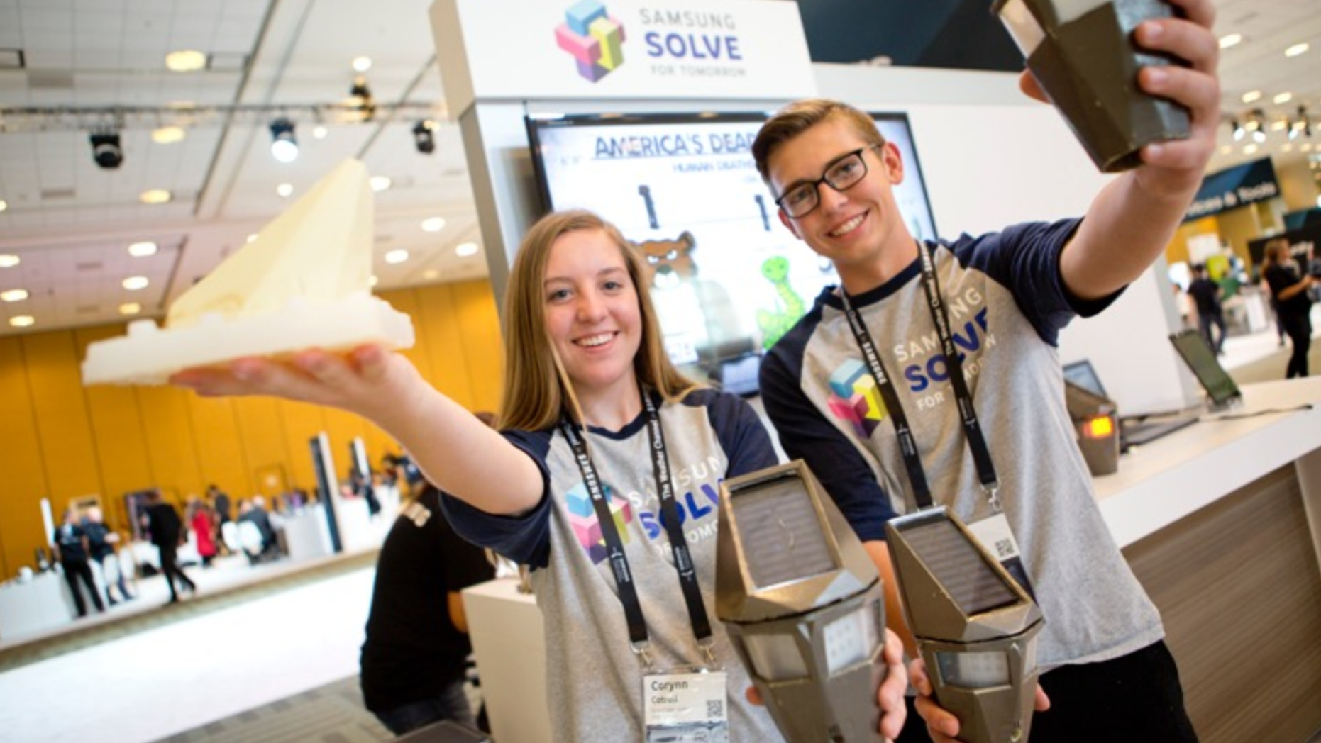 Students from Snowflake Junior High School show off their low-cost wildlife detection system that alerts drivers of animals crossing the road to mitigate accidents to attendees at the Samsung Developer Conference on October 19, 2017.