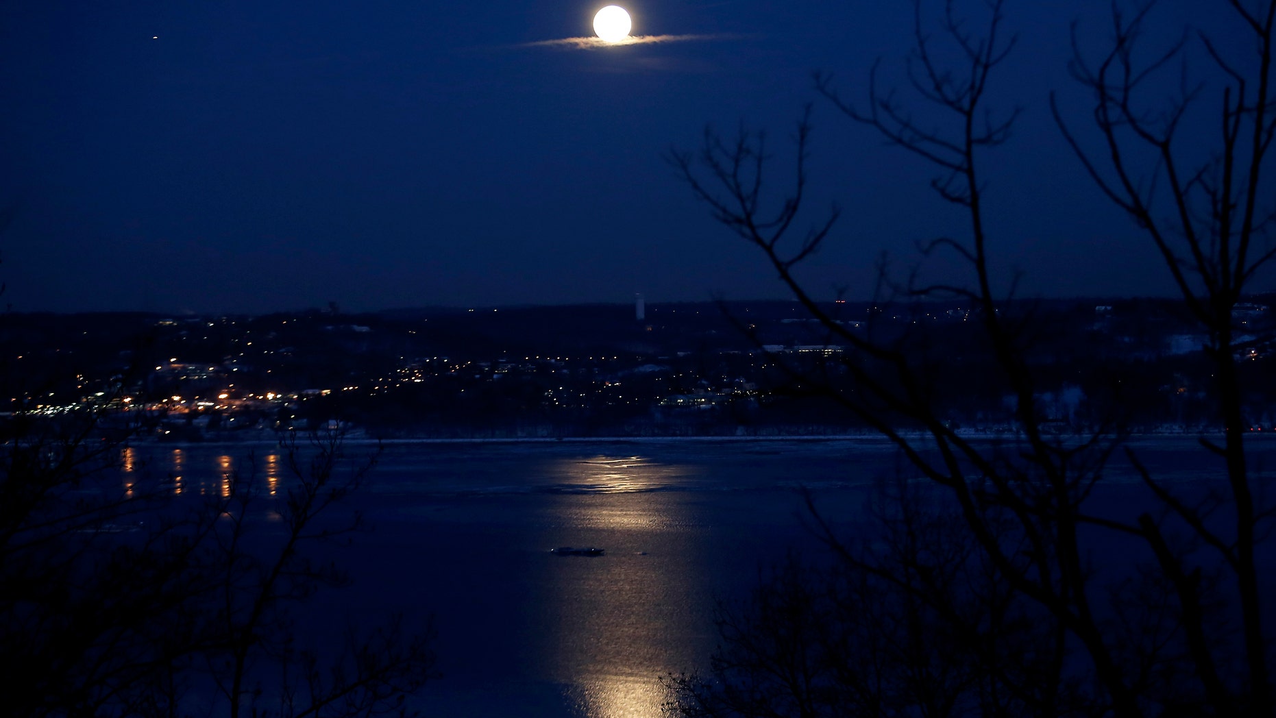 The full "Snow" moon rises above the Hudson River and the town of Irvington in Westchester County New York as seen from the west side of the Hudson in the town of Orangeburg in Rockland County, New York February 3, 2015. "Snow" moon is a traditional name for the full moon that occurs in the winter month of February in North America. (REUTERS/Mike Segar)