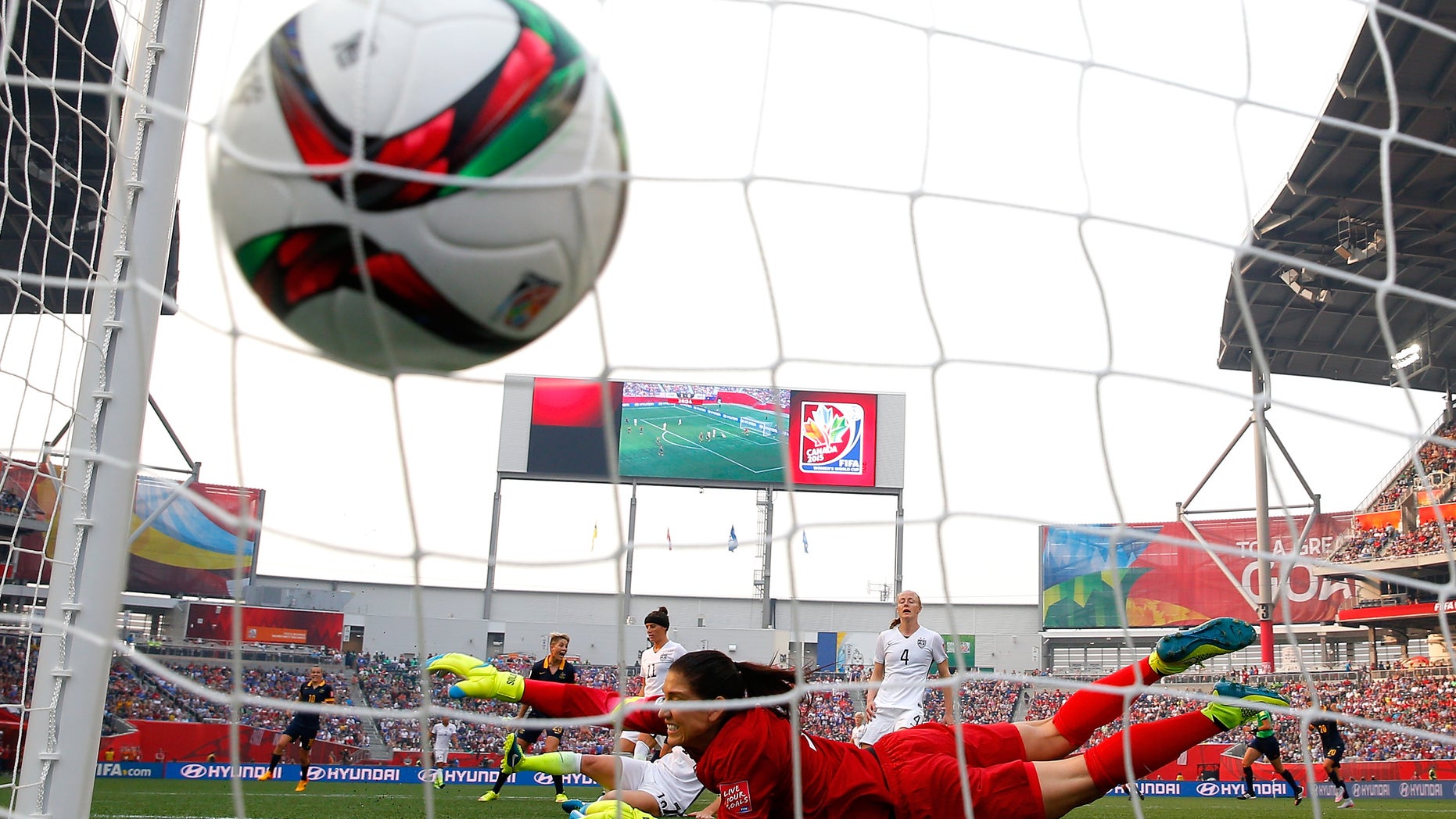WINNIPEG, MB - JUNE 08: Lisa De Vanna #11 of Australia scores a first half goal past a diving Hope Solo #1 of United States during the FIFA Women's World Cup 2015 Group D match at Winnipeg Stadium on June 8, 2015 in Winnipeg, Canada. (Photo by Kevin C. Cox/Getty Images)