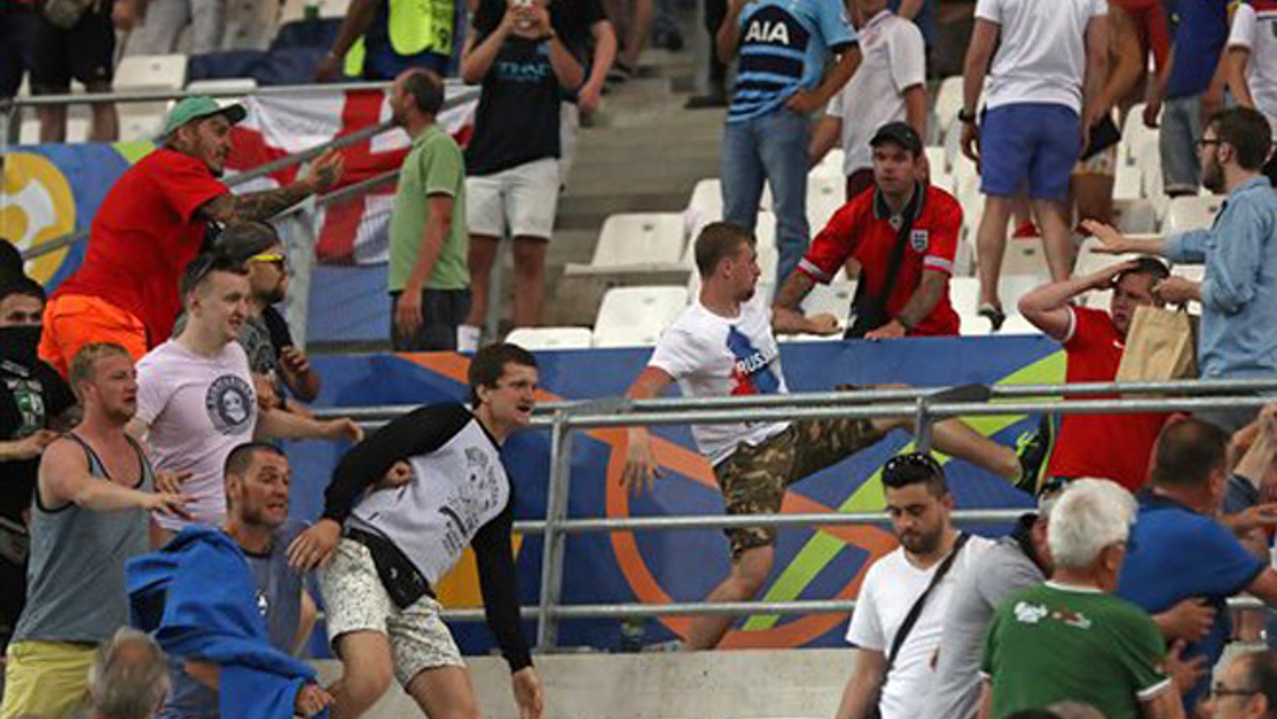 Russian supporters attack England fans at the end of the Euro 2016 Group B soccer match between England and Russia, at the Velodrome stadium in Marseille, France, Saturday, June 11, 2016. (AP Photo/Thanassis Stavrakis)