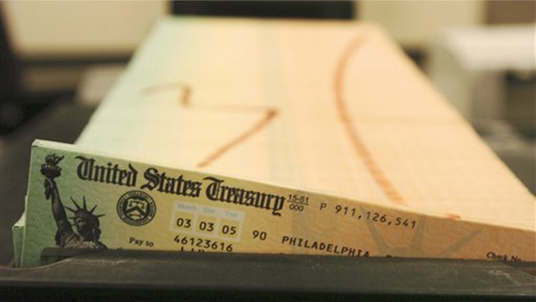 In this Feb. 11, 2005, file photo, trays of printed social security checks wait to be mailed from a facility in Philadelphia.