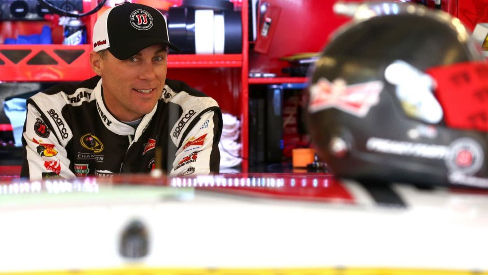 JOLIET, IL - SEPTEMBER 18: Kevin Harvick, driver of the #4 Jimmy John's / Budweiser Chevrolet, stands in the garage area during practice for the NASCAR Sprint Cup Series myAFibRisk.com 400 at Chicagoland Speedway on September 18, 2015 in Joliet, Illinois. (Photo by Sarah Crabill/NASCAR via Getty Images)
