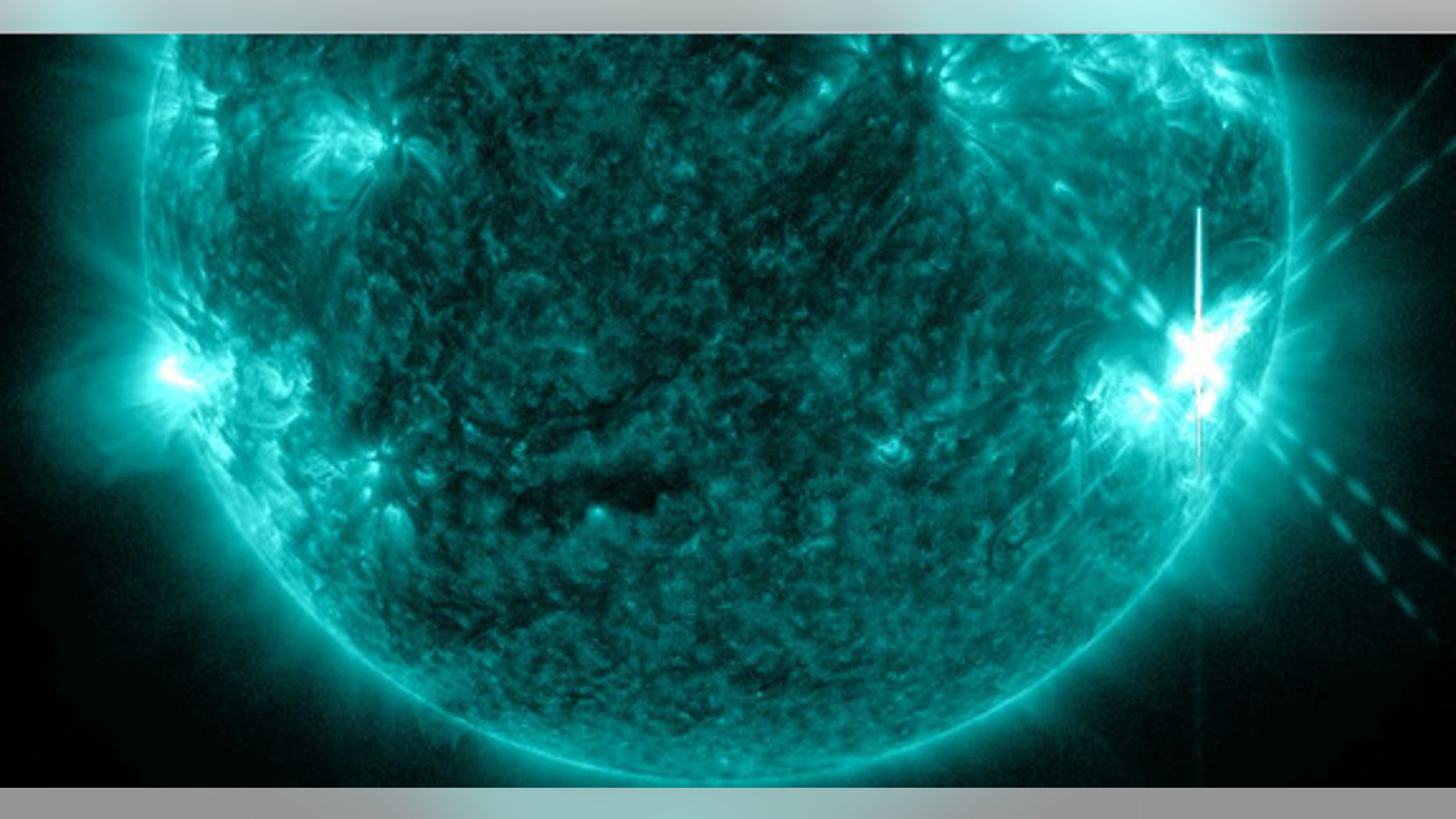 An X1.1-class solar flare (lower right) erupts from the sun on July 6, 2012, in this image from NASA's Solar Dynamics Observatory.