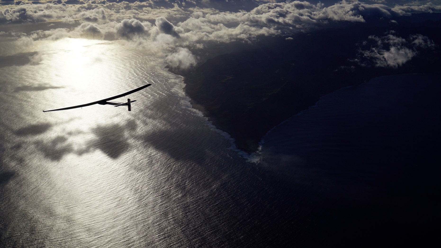 In this photo provided by Solar Impulse, the solar-powered plane, Solar Impulse 2, piloted by Bertrand Piccard, is seen in the air Thursday, April 21, 2016, after successfully taking off from Kalaeloa Airport, Hawaii, for a non-stop three day flight expected to cover about 2,336 miles to Moffett Airfield, Calif. (Jean Revillard/Solar Impulse via AP)
