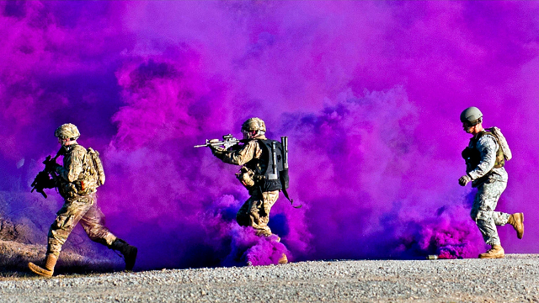 Jan. 14, 2012: Paratroopers run through a smokescreen during a live-fire exercise at the Joint Readiness Training Center, Fort Polk, La. Hight-tech undergarments will let the Army monitor warfighters of the future -- alerting a command center to the exact status of men on the ground.