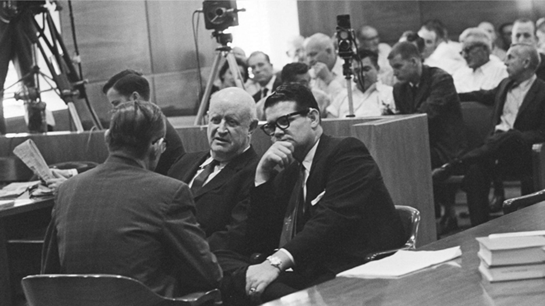 Sept. 25, 1962: In this file photo, Billie Sol Estes, right, confers with his attorneys, John Cofer, center, and John Dennison during recess in trial in Tyler, Texas