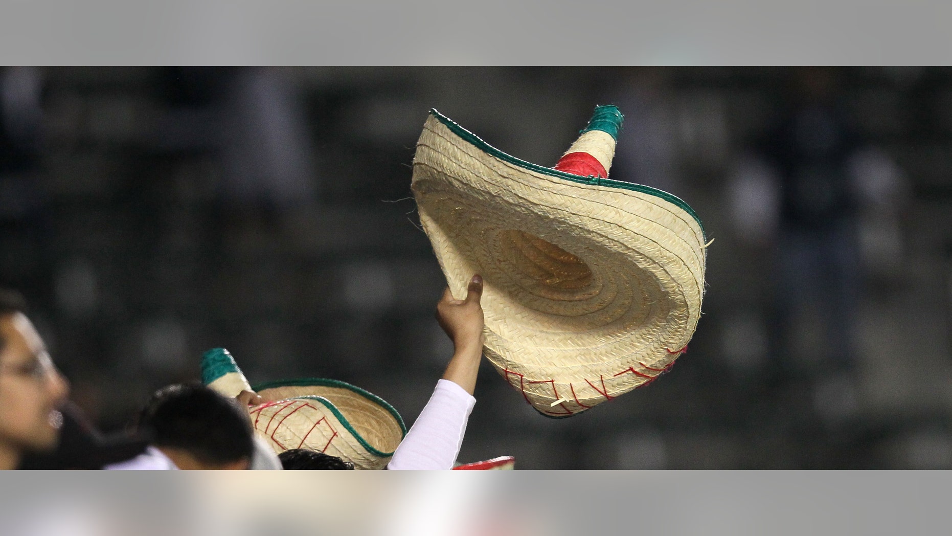 CARSON, CA - MARCH 23: A Mexico fan celebrates by waving a sombrero aftera goal by Diego Reyes #13 against Trinidad and Tobago during the second day of 2012 CONCACAF Men's Olympic Qualifying at The Home Depot Center on March 23, 2012 in Carson, California. (Photo by Stephen Dunn/Getty Images)