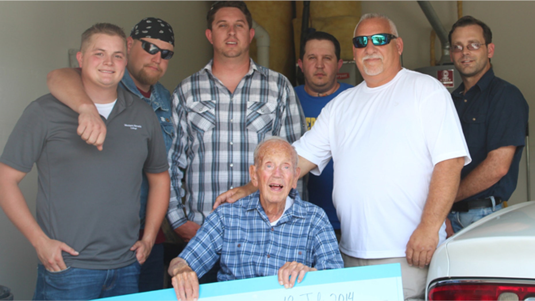 James V. Sorrentino, of Carson City, Nev., received the hefty lump sum in the form of an oversized check from members of Western Nevada College’s Veterans Resource Center on Friday, nearly two months after two men forced their way into his home looking for a safe on May 25. (Courtesy: Western Nevada College Veterans Resource Center)