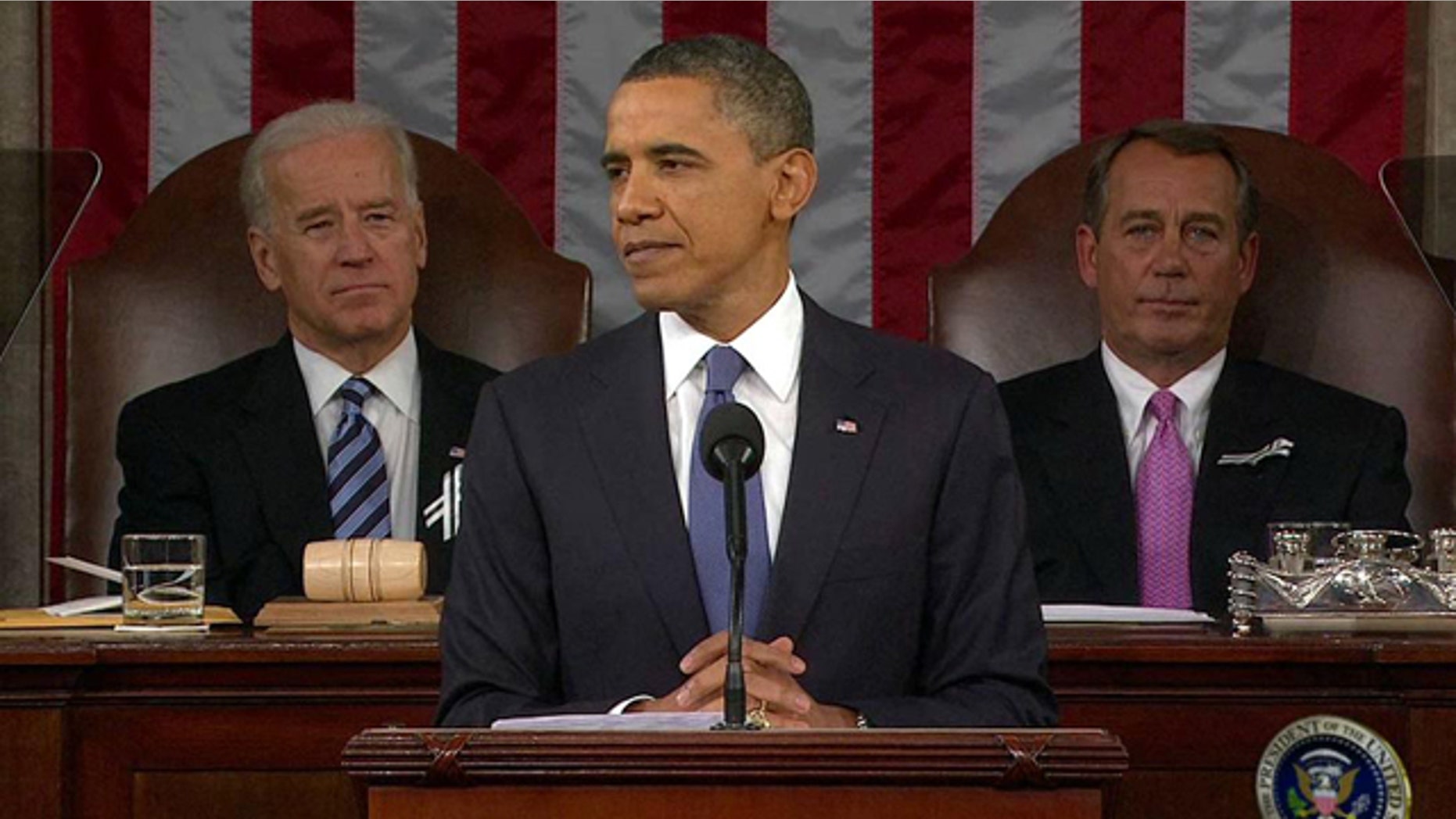 Jan. 25: President Obama addresses Congress during his State of the Union Address as Vice President Joe Biden and House Speaker John Boehner listen.