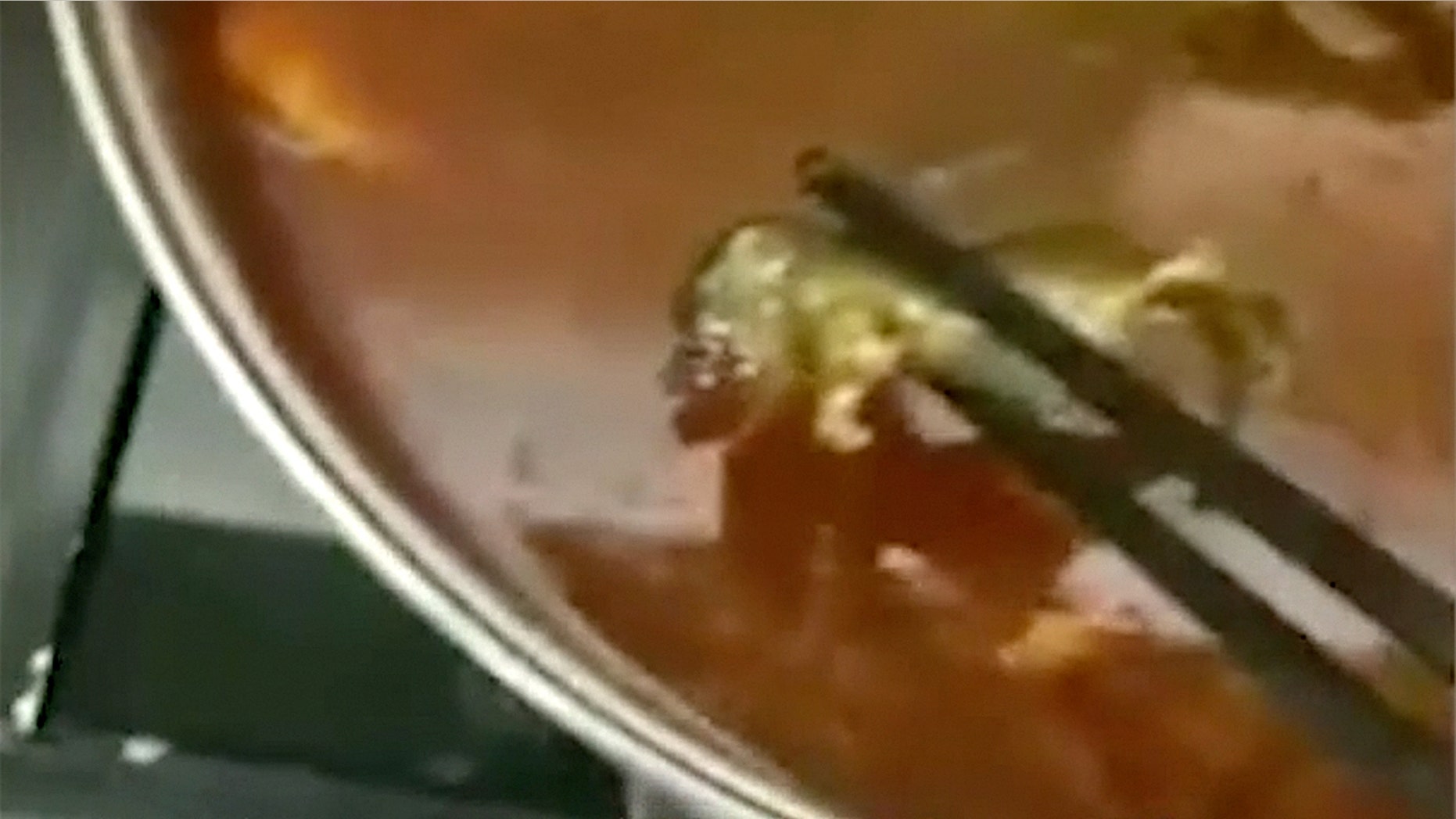 The woman eating at a restaurant chain in China made the disgusting discovery a few bites into her meal.