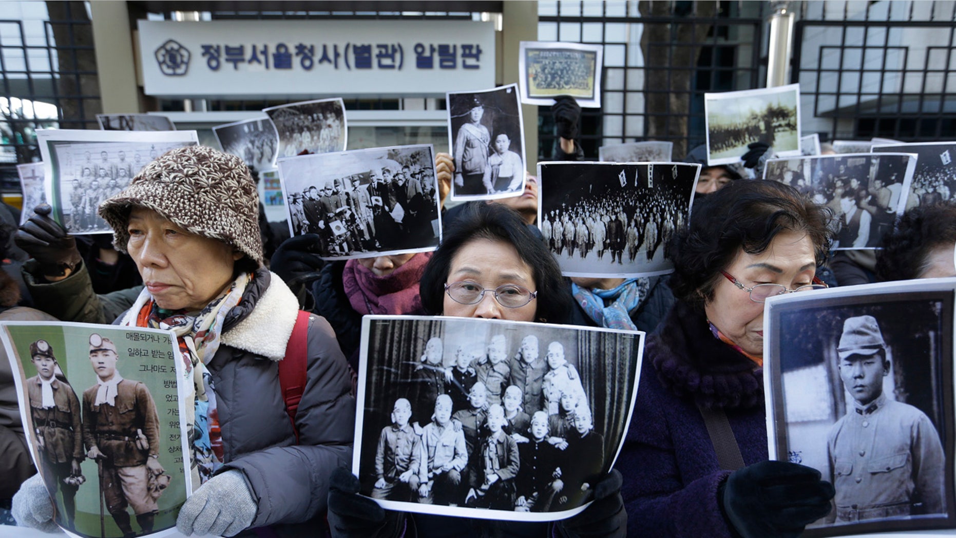 Dec. 28, 2015: Bereaved family members of South Korean victims of World War II stage a rally in front of the Foreign Ministry in Seoul demanding full compensation and an apology from the Japanese government (AP Photo/Ahn Young-joon)
