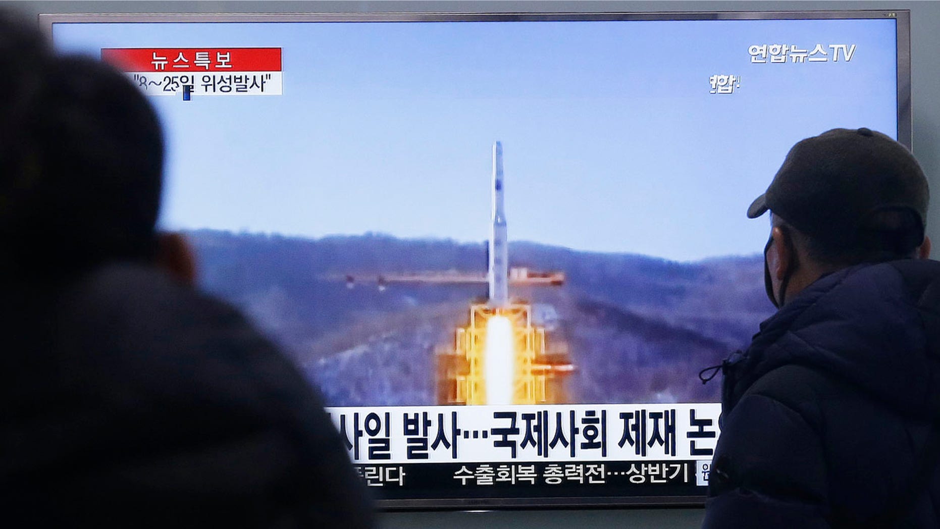 Feb. 3, 2016: South Koreans watch a TV news program with a file footage about North Korea's rocket launch plans at Seoul Railway Station. (AP Photo/Ahn Young-joon)