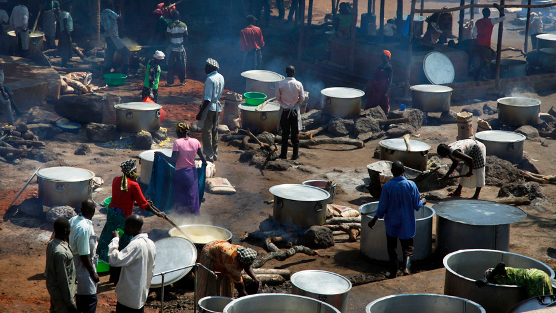 Aug. 29, 2016: Refugees prepare food in a transit center for South Sudanese refugees in the remote northwestern district of Adjumani, near the border with South Sudan, in Uganda.