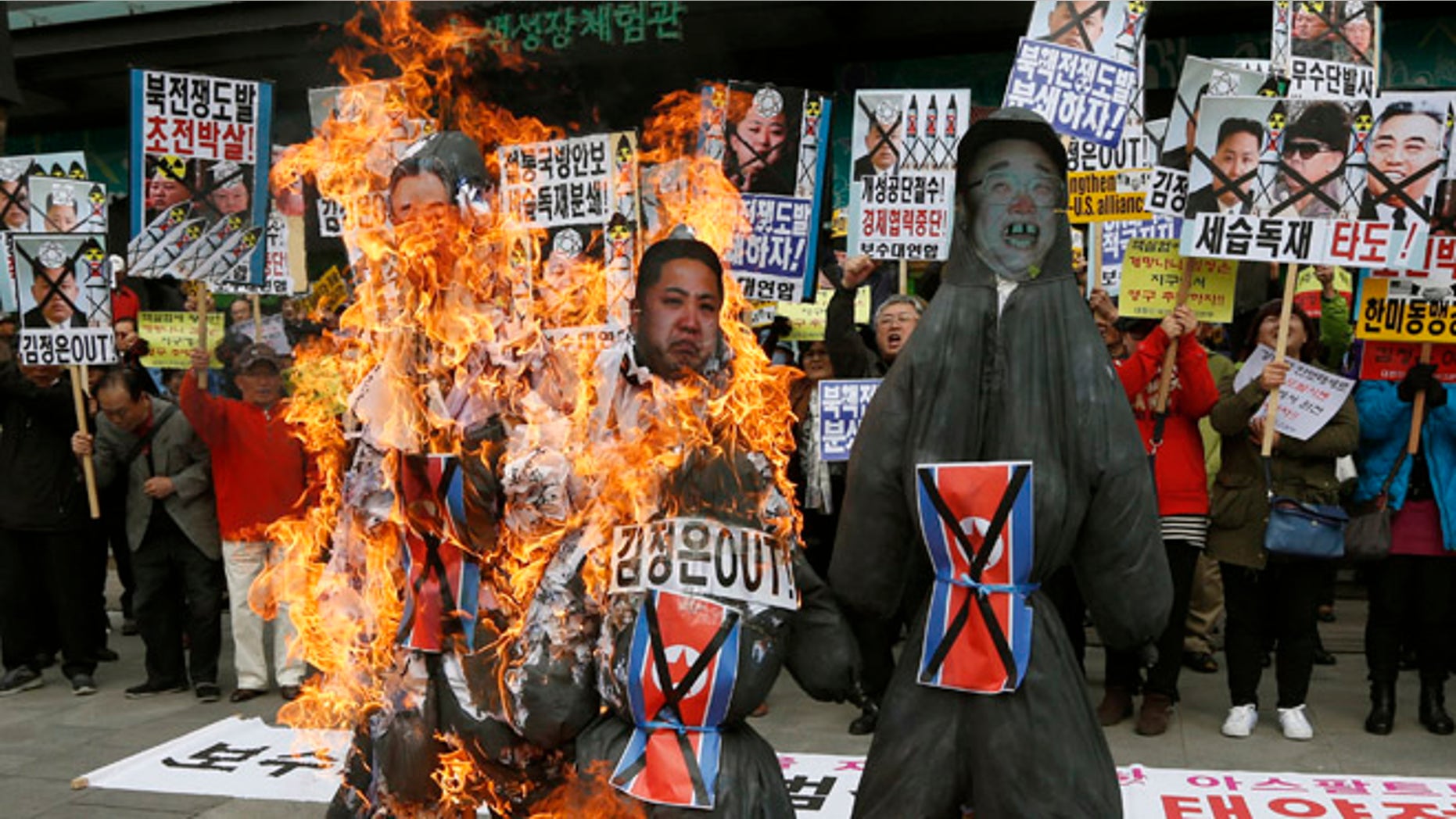 April 15, 2013: South Korean protesters burn effigies of North Korean leader Kim Jong Un, and late leaders Kim Jong Il and Kim Il Sung at an anti-North Korea protest on the birthday of Kim Il Sung in Seoul, South Korea.