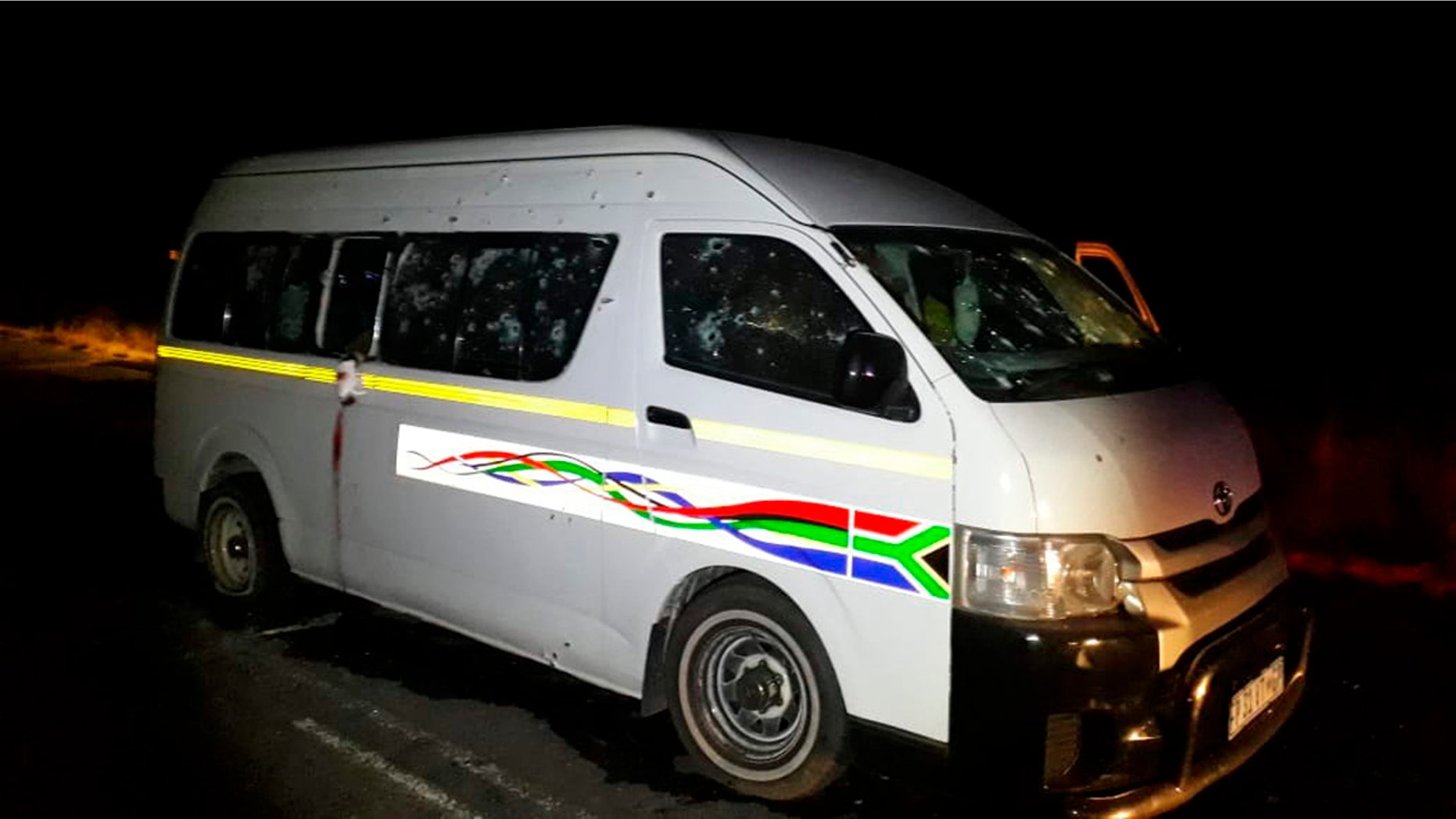 A minibus with bullet holes on its side is seen on the road between Weenen and Colenso, in KwaZulu Natal province, South Africa, early Sunday, July 22, 2018.