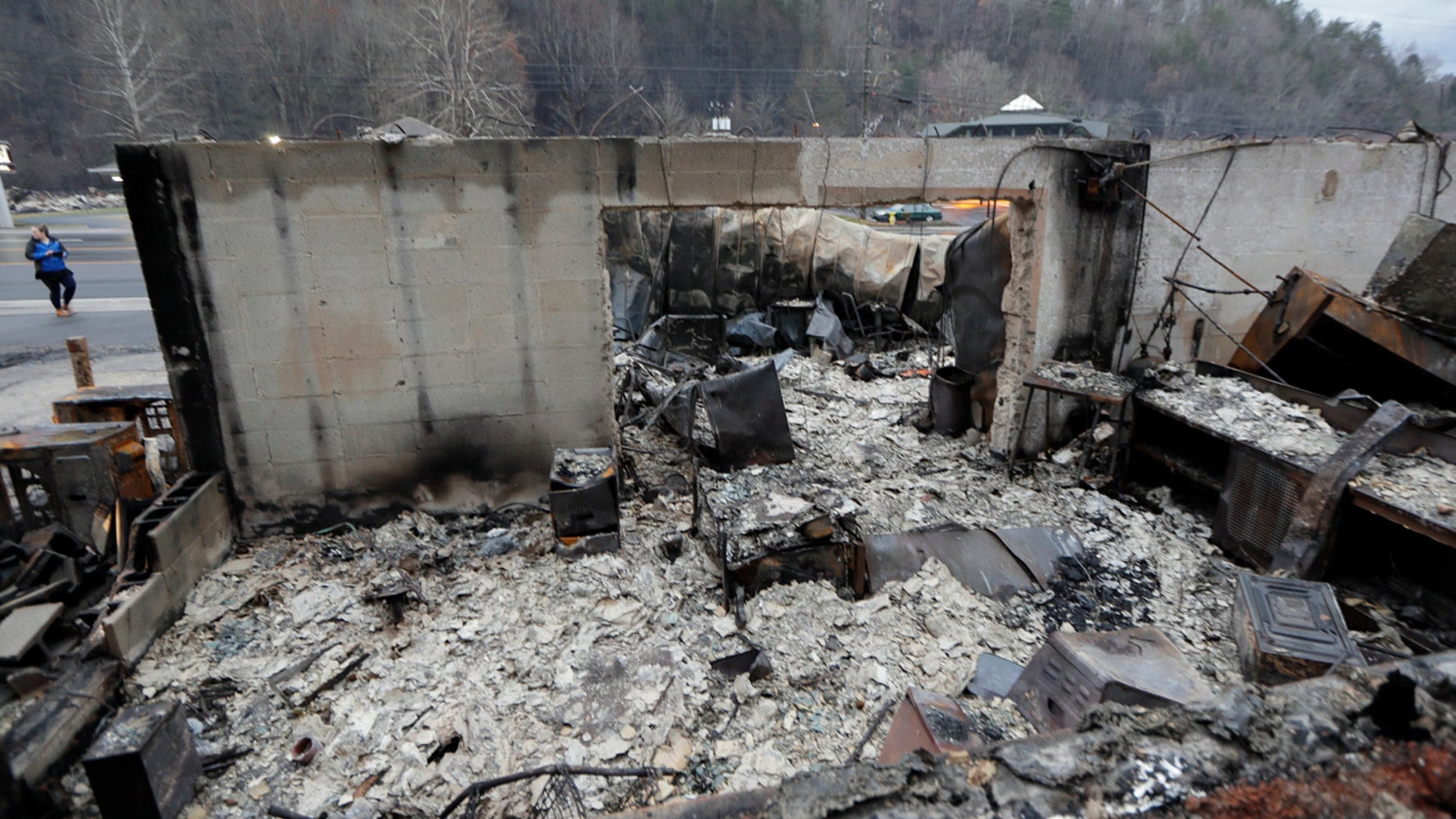 Some walls of a burned-out business remain Wednesday, Nov. 30, 2016, in Gatlinburg, Tenn., after a wildfire swept through the area Monday.