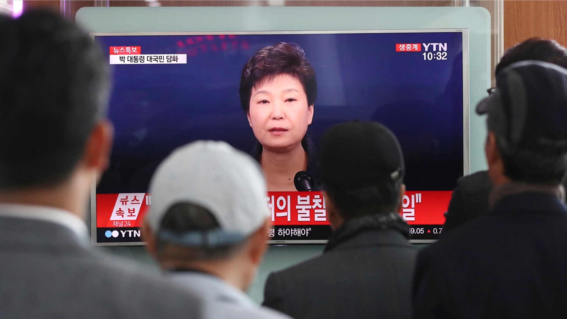 Nov. 4, 2016: People watch a TV screen showing the live broadcast of South Korean President Park Geun-hye's address to the nation, at the Seoul Railway Station in Seoul, South Korea.