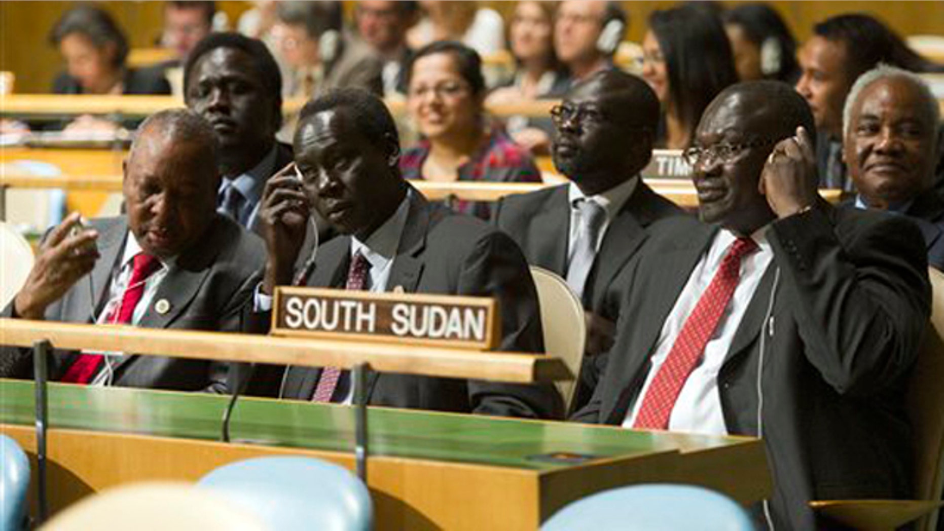 In this photo provided by the United Nations, members of the delegation of the Republic of South Sudan, led by Vice President Riek Machar Teny-Dhurgon, right, are seated in United Nations General Assembly, Thursday, July 14, 2011.