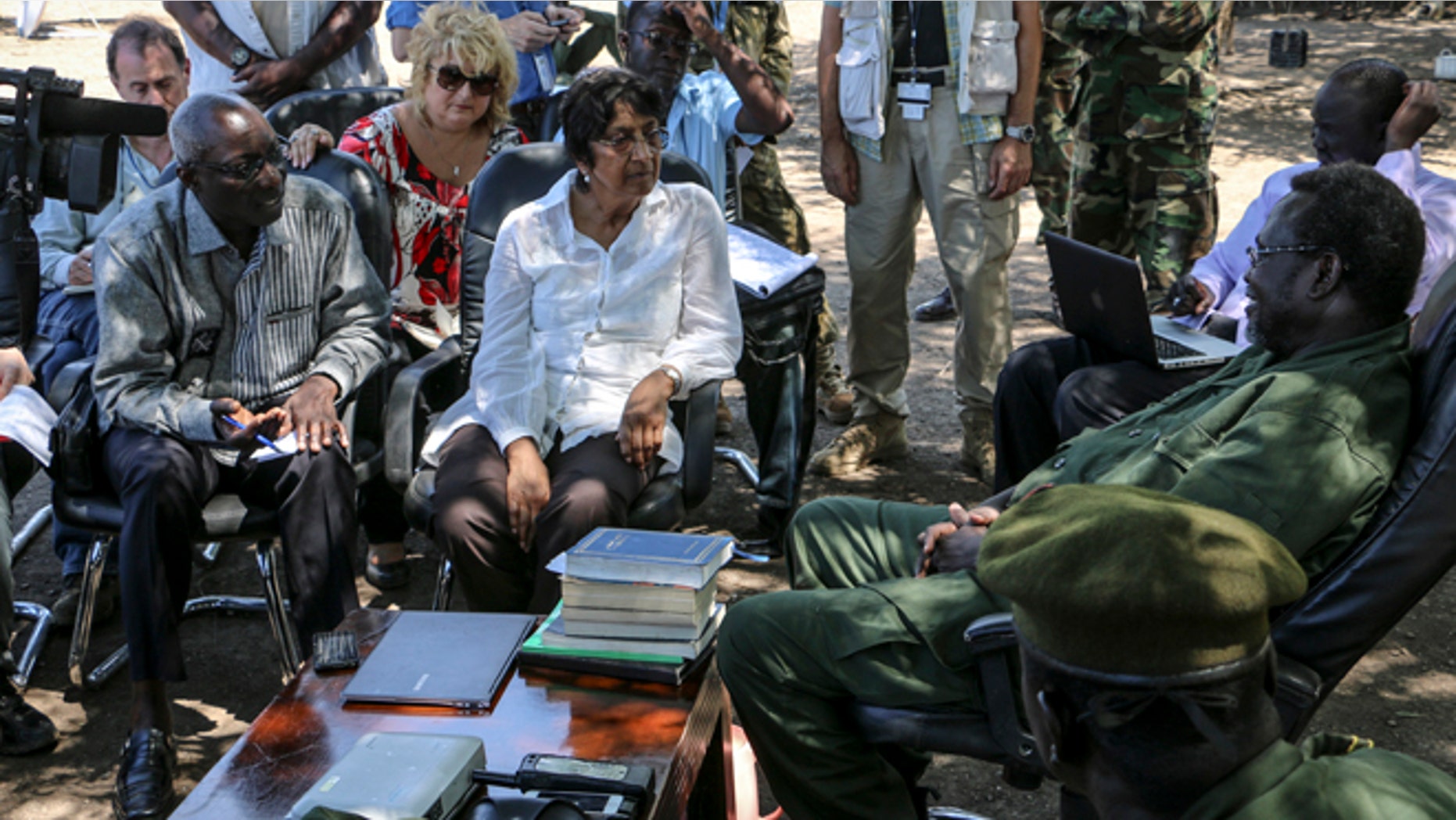 April 29, 2014: United Nations High Commissioner for Human Rights Navi Pillay, center, accompanied by Special Adviser on the Prevention of Genocide Adama Dieng, left, meets with South Sudan's former Vice President and now rebel leader Riek Machar, right, at an undisclosed location in South Sudan.
