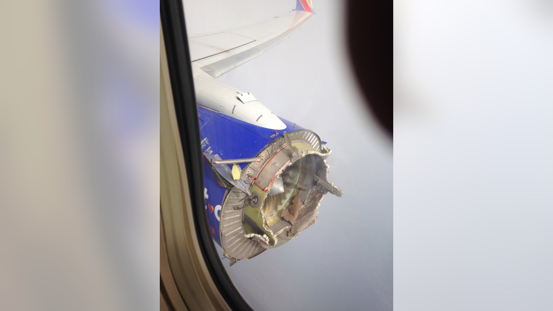 This Saturday, Aug. 27, 2016, file photo shows an engine through a window of a Southwest Airlines flight.