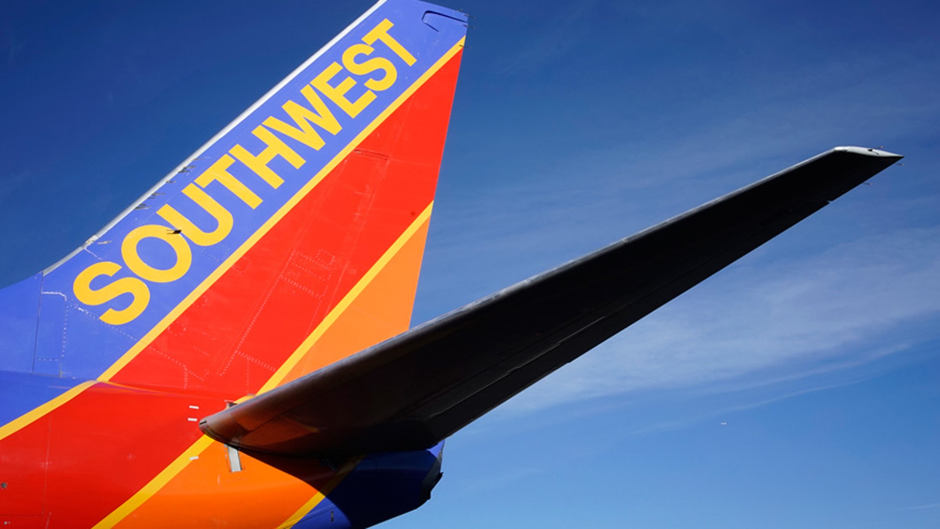 A Southwest pilot showered his millionth customer with Champagne and cash.