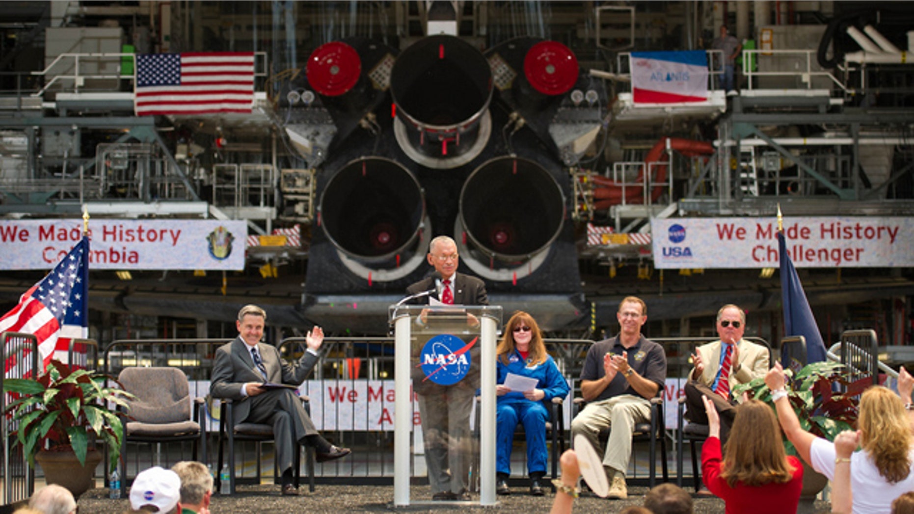 NASA Administrator Charles Bolden announces where four space shuttle orbiters will be permanently displayed at the conclusion of the Space Shuttle Program during an event held at one of the Orbiter Processing Facilities, Tuesday, April 12, 2011, at Kennedy Space Center in Cape Canaveral, Fla. The four orbiters, Enterprise, which currently is on display at the Smithsonian's Steven F. Udvar-Hazy Center near Washington Dulles International Airport, will move to the Intrepid Sea, Air & Space Museum in New York, Discovery will move to Udvar-Hazy, Endeavour will be displayed at the California Science Center in Los Angeles and Atlantis, in background, will be displayed at the Kennedy Space Center Visitors Complex. Photo Credit: (NASA/Bill Ingalls)