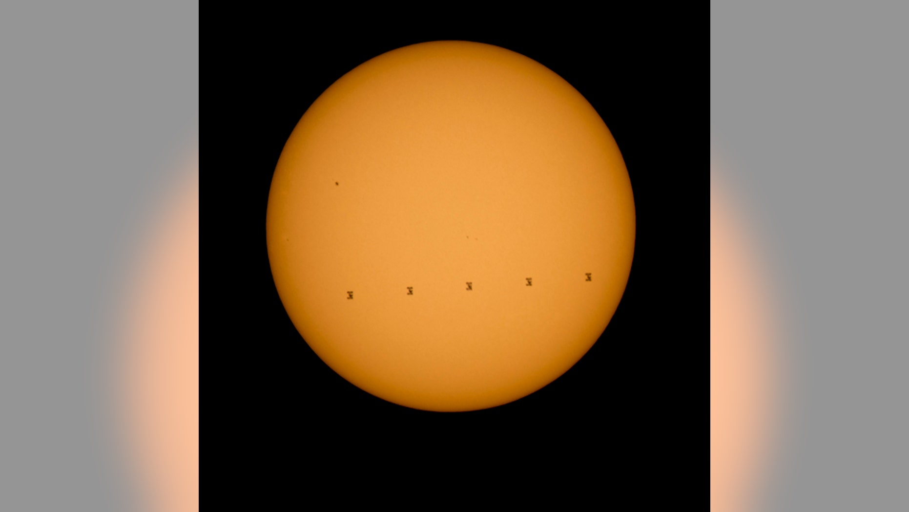 This composite photo made from five images shows the International Space Station crossing the sun’s face on Sept. 6, 2015. The images were captured from Shenandoah National Park in Virginia.