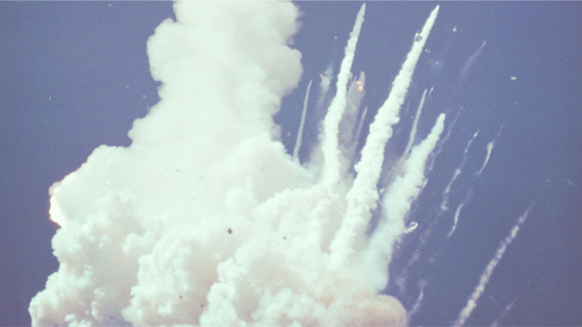 At 78 seconds after liftoff, this image shows Challenger's left wing, main engines (still burning residual propellant) and the forward fuselage (crew cabin).
