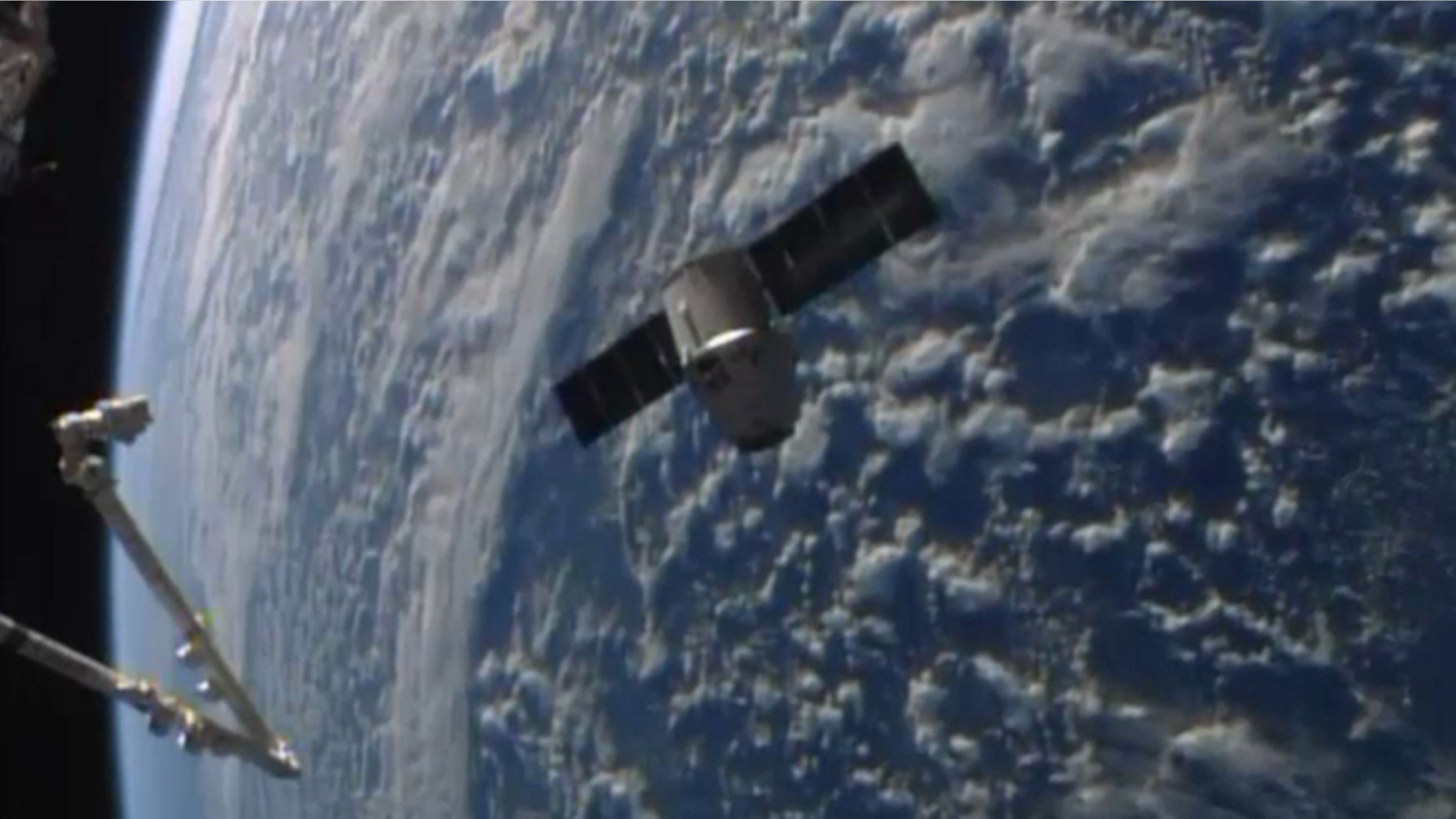 April 20, 2014: This frame grabbed image from NASA-TV shows the SpaceX Dragon resupply capsule approaching the International Space Station.