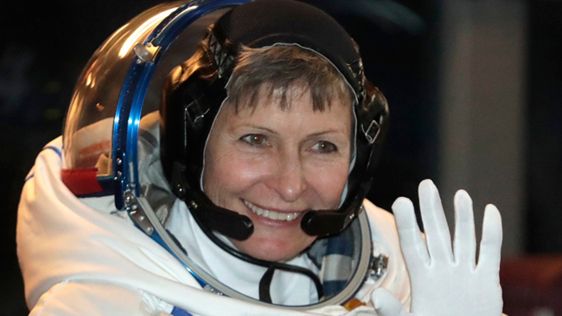 U.S. astronaut Peggy Whitson, member of the main crew of the expedition to the International Space Station, waves from a bus prior to the launch of Soyuz MS-3 spaceship.